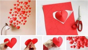 تزيين المنزل والحوائط من خلال قص قطع ورقية على شكل قلوب ولصقها على الحائط